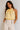 Top dos nu satiné jaune pour femme avec encolure à nouer - vue de face