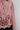 Détail des broderies florales et de la finition festonnée de la chemise femme