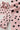 Détail de l'imprimé à pois noirs de la chemise rose femme