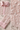 Détail des broderies florales de la chemise rose femme