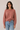 Pull en maille rose avec lien à nouer